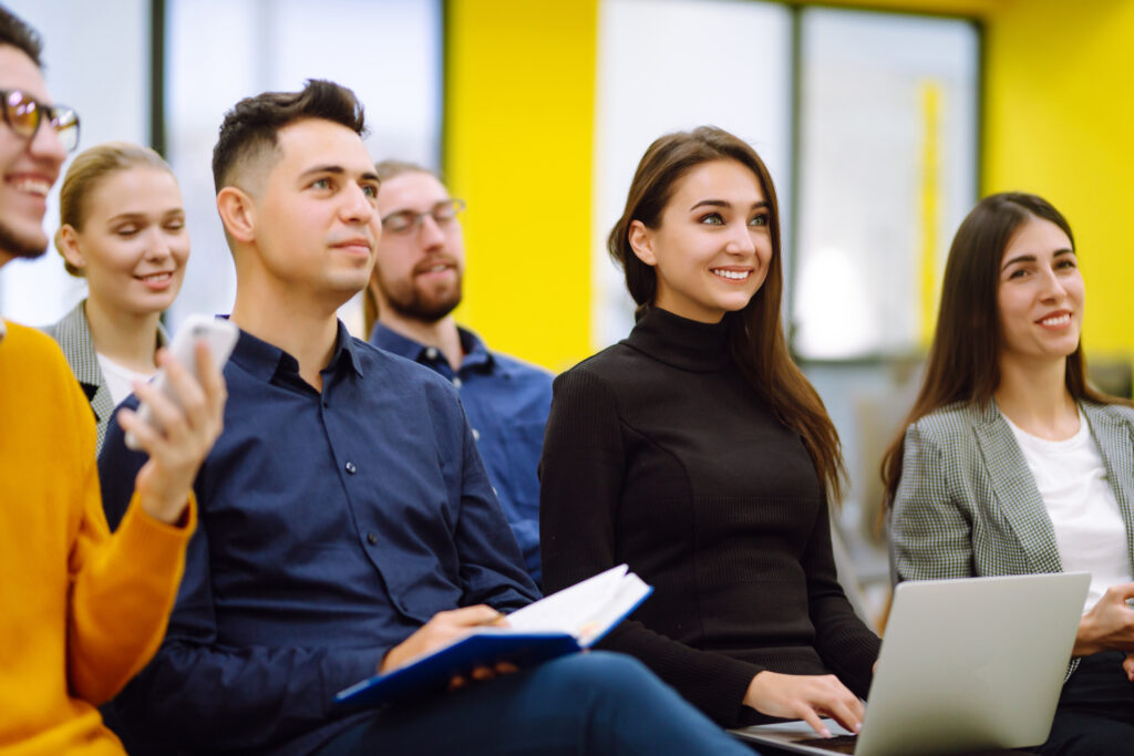 Group of people listening to speaker